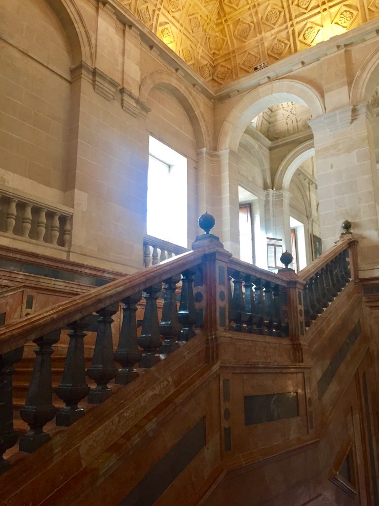 Read marble stairway, added in the 1700s during restoration