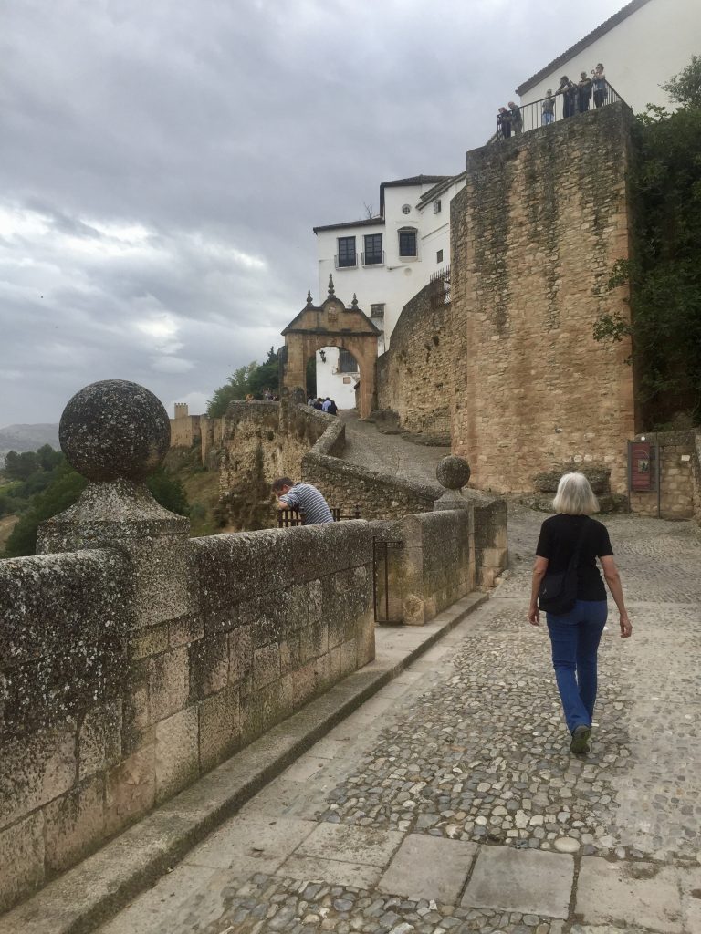 Walking across the Roman bridge toward the old main gate to the city