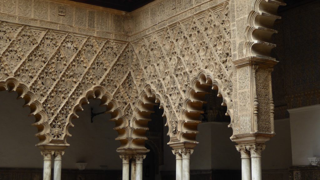 Scalloped arches, intricate molded decoration